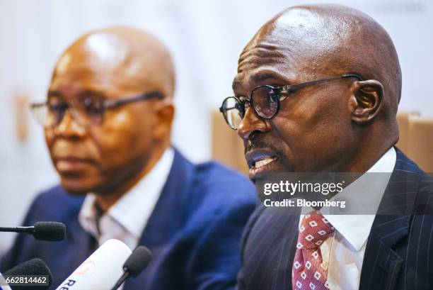 Malusi Gigaba, South Africa's finance minister, right, speaks during a news conference in Pretoria, South Africa, on Saturday, April 1, 2017....