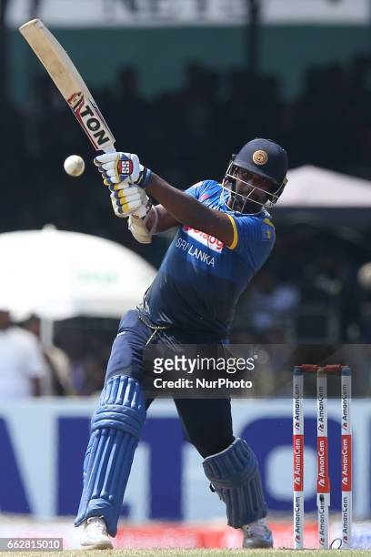 Srilanka's Thisara Perera plays a shot during the third one-day international cricket match between Sri Lanka &amp; Bangladesh at SSC International...