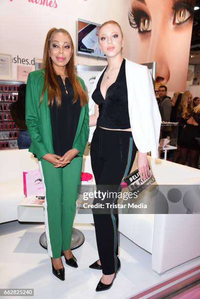 Anna Ermakova and her mother Angela Ermakova visit 'Miss Lashes' lashes lounge at the Beauty & Top Hair Fair on April 1, 2017 in Duesseldorf, Germany.