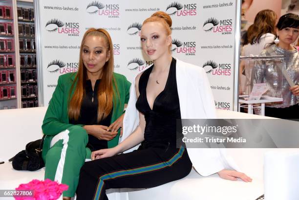 Anna Ermakova and her mother Angela Ermakova visit 'Miss Lashes' lashes lounge at the Beauty & Top Hair Fair on April 1, 2017 in Duesseldorf, Germany.