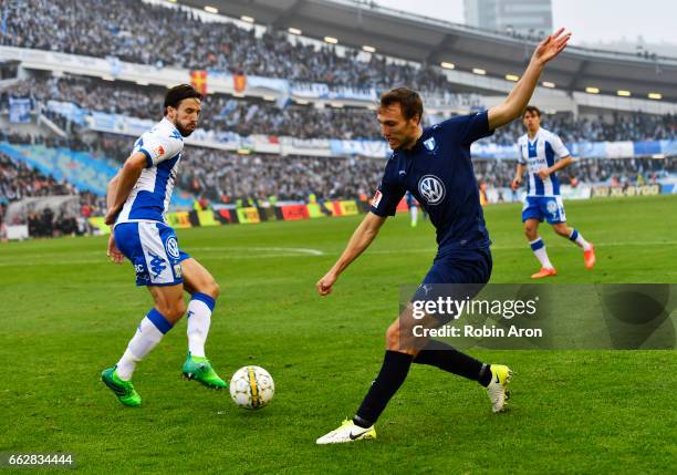 Mattias Bjarsmyr of IFK Goteborg and Magnus Wolf Eikrem of Malmo FF competes for the ball during the Allsvenskan match between IFK Goteborg and Malmo...