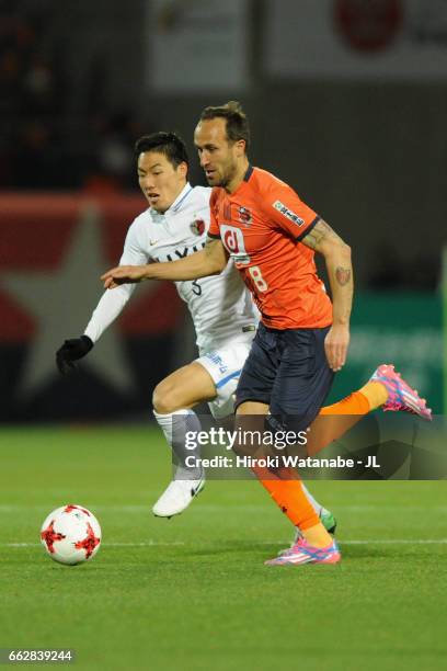 Dragan Mrdja of Omiya Ardija and Gen Shoji of Kashima Antlers compete for the ball during the J.League J1 match between Omiya Ardija and Kashima...