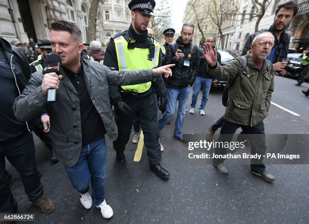 Former spokesman and leader of the English Defence League Tommy Robinson argues with a protestor in London, during a counterprotest by UAF against...