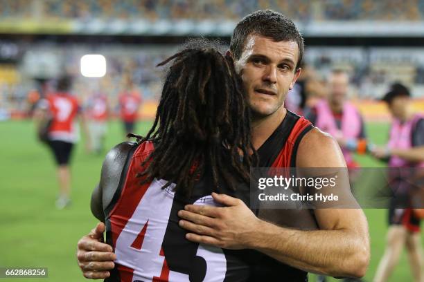 Brent Stanton of the Bombers celebrates after playing his 250th match during the round two AFL match between the Brisbane Lions and the Essendon...