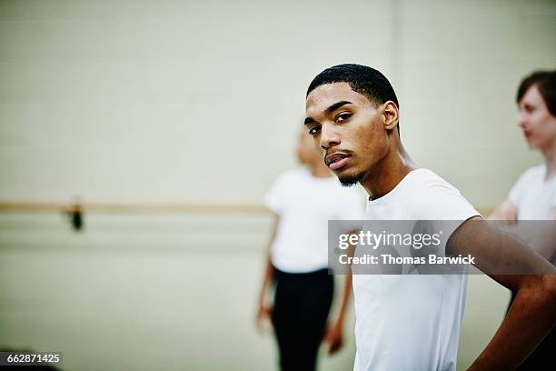 male ballet dancer resting during rehearsal - boy ballet stock pictures, royalty-free photos & images