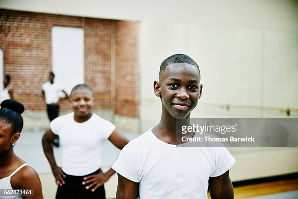 smiling portrait of ballet dancer in dance studio - ballet boy stockfoto's en -beelden