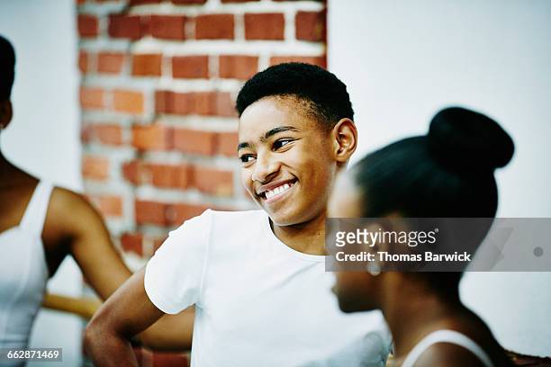 smiling male ballet dancer with classmates - ballet boy foto e immagini stock