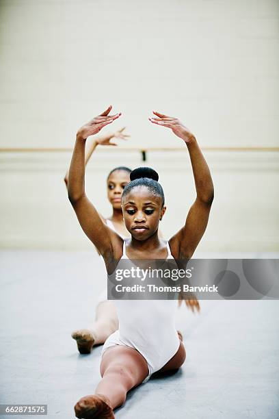 ballet dancer doing splits during rehearsal - acrobatic activity stock pictures, royalty-free photos & images