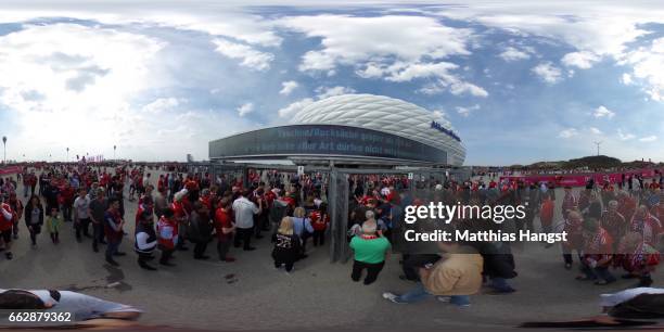 Fans arrive ahead of the Bundesliga match between Bayern Muenchen and FC Augsburg at Allianz Arena on April 1, 2017 in Munich, Germany.