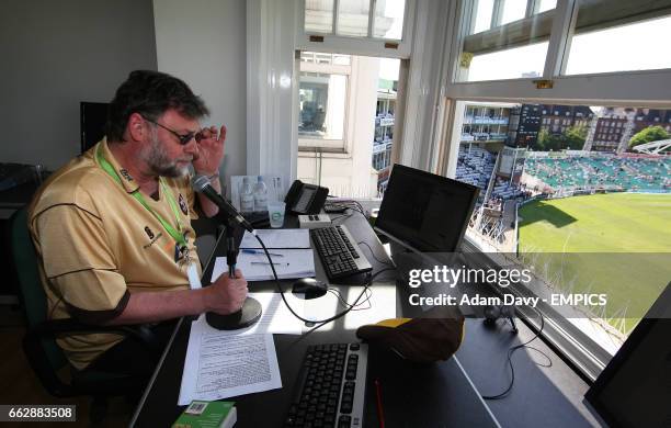Scoreboard announcer and big screen controller Brian Raine, in the press box in the Bedser Stand.
