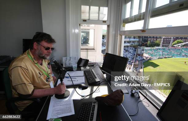Scoreboard announcer and big screen controller Brian Raine, in the press box in the Bedser Stand.