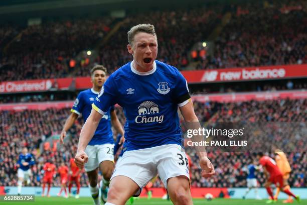 Everton's English defender Matthew Pennington celebrates after scoring their first goal during the English Premier League football match between...