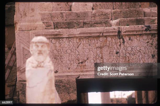 Roman script remains visible on a building facade September 12, 1999 in Leptis Magna, Libya. Originally established by the Phoenicians in the sixth...