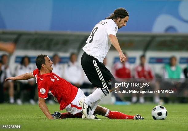 Poland's Dariusz Dudka and Germany's Torsten Frings battle for the ball