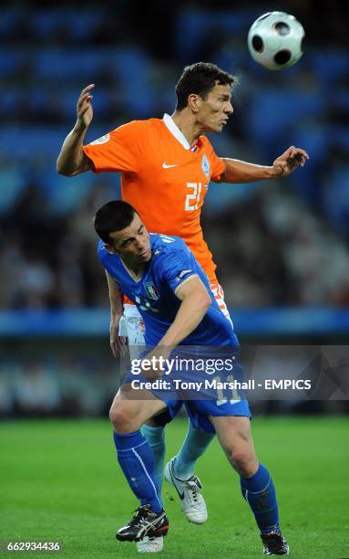 Holland's Khalid Boulahrouz heads the ball clear from Italy's Antonio Di Natale.