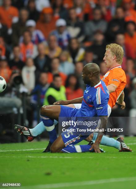 Holland's Dirk Kuyt scores the first goal past France's William Gallas