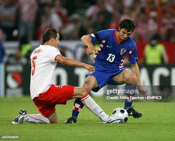 Croatia's Nikola Pokrivac and Poland's Dariusz Dudka battle for the ball
