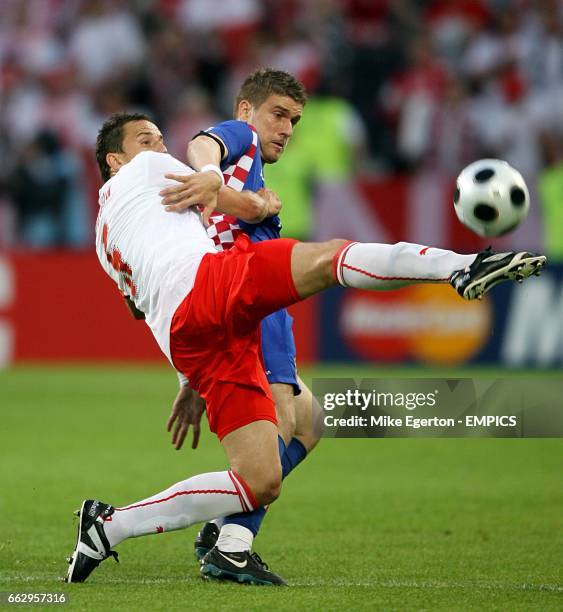 Croatia's Ivan Klasnic and Poland's Dariusz Dudka battle for the ball