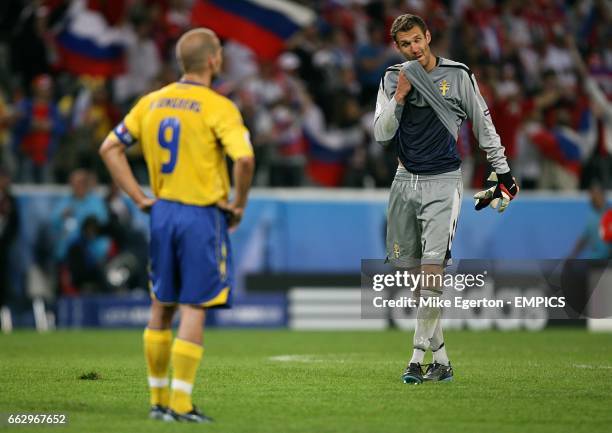 Sweden's Andreas Isaksson and Fredrik Ljungberg look dejected after the final whistle.