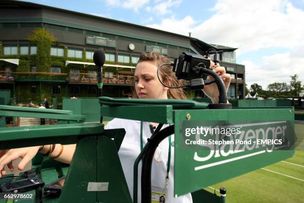 Court attendant sets up a umpires computer