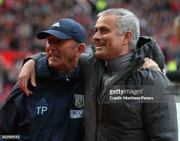 Manager Jose Mourinho of Manchester United greets Manager Tony Pulis of West Bromwich Albion ahead of the Premier League match between Manchester...