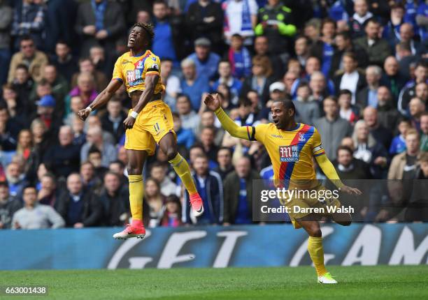 Wilfried Zaha of Crystal Palace celebrates scoring his sides first goal with Jason Puncheon of Crystal Palace during the Premier League match between...