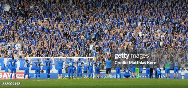 The players of Magdeburg celebrate with their supporters after winning the third league match between 1.FC Magdeburg and Rot Weiss Erfurt at MDCC...