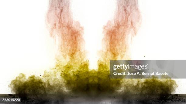 blackground of particles of yellow powder in ascending movement floating in the air produced by an impact - etéreo stock pictures, royalty-free photos & images