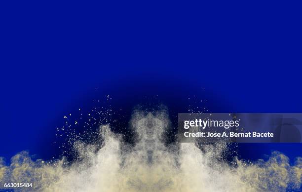 blackground of particles of white powder in ascending movement floating in the air produced by an impact - partícula stock pictures, royalty-free photos & images