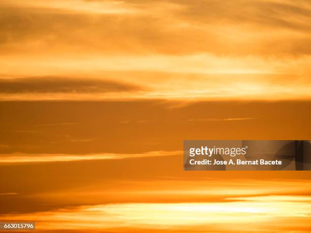 full frame colorful clouds at sunset - esfera stock-fotos und bilder