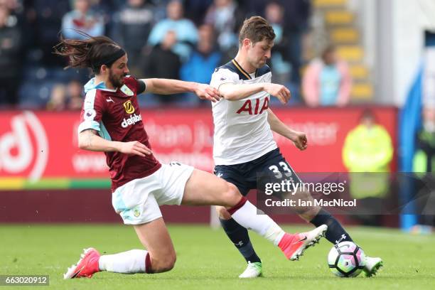 George Boyd of Burnley puts pressure on Ben Davies of Tottenham Hotspur during the Premier League match between Burnley and Tottenham Hotspur at Turf...