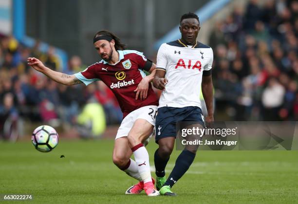 George Boyd of Burnley and Victor Wanyama of Tottenham Hotspur battle for possession during the Premier League match between Burnley and Tottenham...