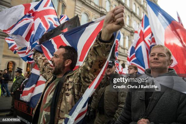 Protesters chant and wave British Union Jack flags during a protest titled 'London march against terrorism' in response to the March 22 Westminster...