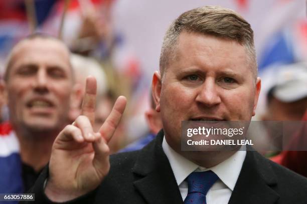 Paul Golding, leader of the far-right organisation Britain First marches in central London on April 1, 2017. - Members of the Britain First group and...