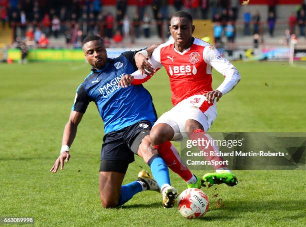 Swindon Town's Jonathan Obika challenges Fleetwood Town's Amari'i Bell during the Sky Bet League One match between Fleetwood Town and Swindon Town at...