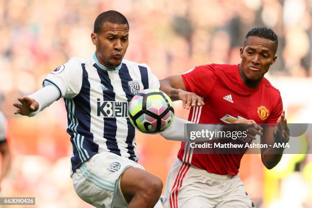 Jose Salomon Rondon of West Bromwich Albion and Luis Antonio Valencia of Manchester United during the Premier League match between Manchester United...