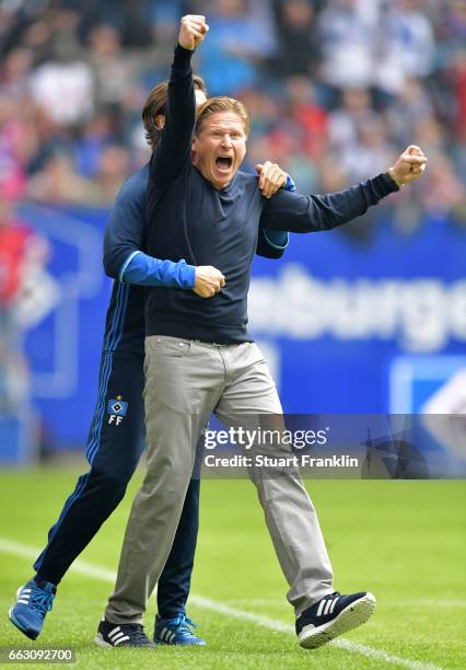 Markus Gisdol, head coach of Hamburg celebrates at the end of the Bundesliga match between Hamburger SV and 1. FC Koeln at Volksparkstadion on April...