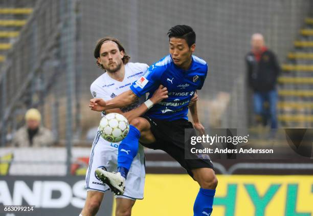 Tom Pettersson of Ostersunds FK and Kosuke Kinoshita of Halmstad BK competes for the ball during the Allsvenskan match between Halmstad BK and...