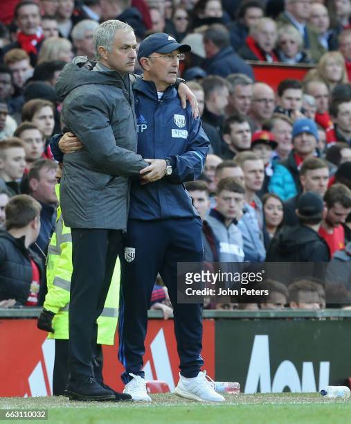 Manager Jose Mourinho of Manchester United and Manager Tony Pulis of West Bromwich Albion watch from the touchline during the Premier League match...
