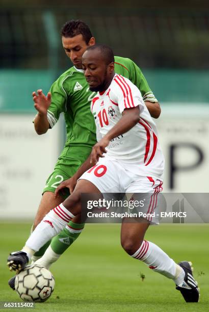 United Arab Emirates' Ismail Matar and Algeria's Cherif Abdesselem battle for the ball.