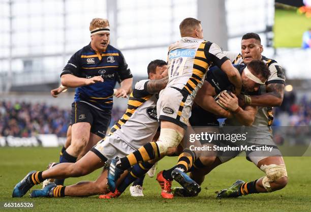 Leinster , Ireland - 1 April 2017; Jack Conan of Leinster is tackled by Wasps players, from left, Alapati Leiua, Jimmy Gopperth and Nathan Hughes...