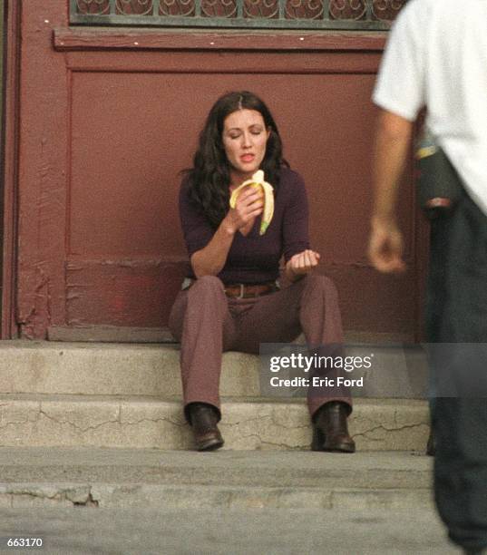 Actress Shannen Doherty enjoys a bannana on the set of "Charmed" on September 27, 2000 in Los Angeles, CA.