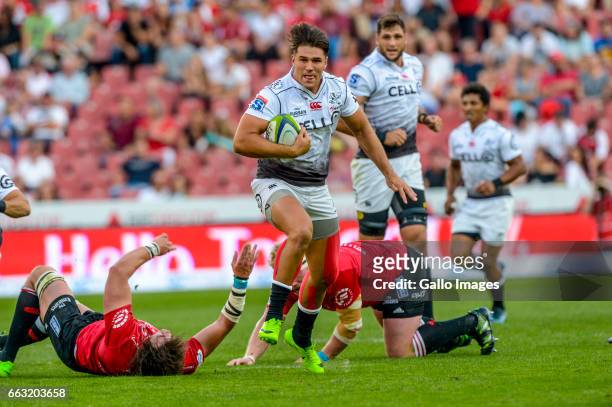 Kobus Van Wyk of the Sharks breaks the Lions defence during the Super Rugby match between Emirates Lions and Cell C Sharks at Emirates Airline Park...