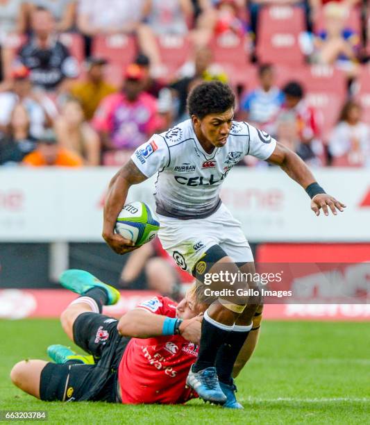 Garth April of the Sharks tackled by Ruan Ackermann of the Lions during the Super Rugby match between Emirates Lions and Cell C Sharks at Emirates...