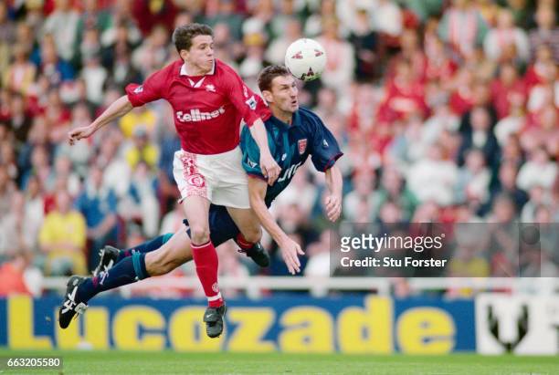 Tony Adams of Arsenal wins the ball ahead of Juninho of Middlesbrough during the FA Carling Premiership match between Middlesbrough and Arsenal at...