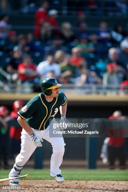 Chris Parmelee of the Oakland Athletics bats during the game against the Los Angeles Angels of Anaheim at Hohokam Stadium on February 26, 2017 in...