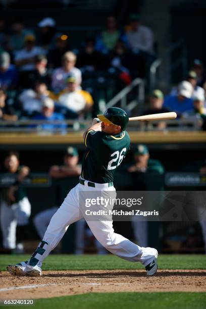 Chris Parmelee of the Oakland Athletics bats during the game against the Los Angeles Angels of Anaheim at Hohokam Stadium on February 26, 2017 in...