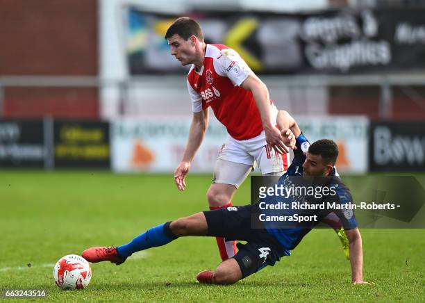 Swindon Town's Conor Thomas challenges Fleetwood Town's Bobby Grant during the Sky Bet League One match between Fleetwood Town and Swindon Town at...