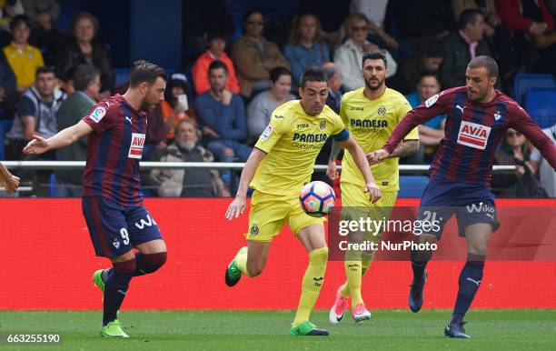 Bruno Soriano of Villarreal CF and Sergi Enrich and Pedro Leon of SD Eibar during their La Liga match between Villarreal CF and SD Eibar at the...