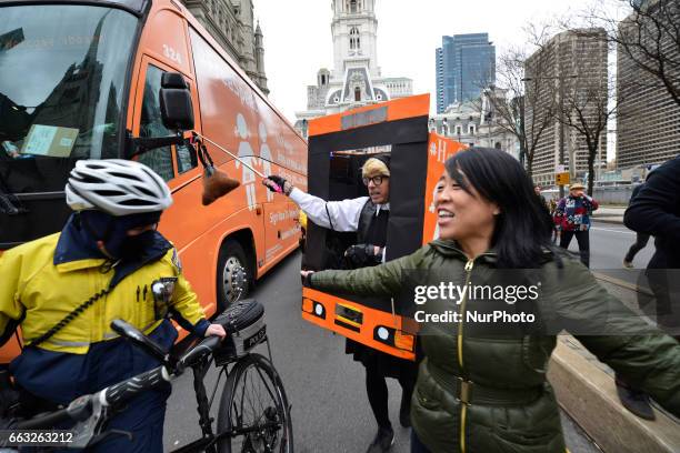 Councilwomen Helen Gym smiles as a counter protest prevents a anti-transgender rights bus from making a stop by counter protestors, in Center City...